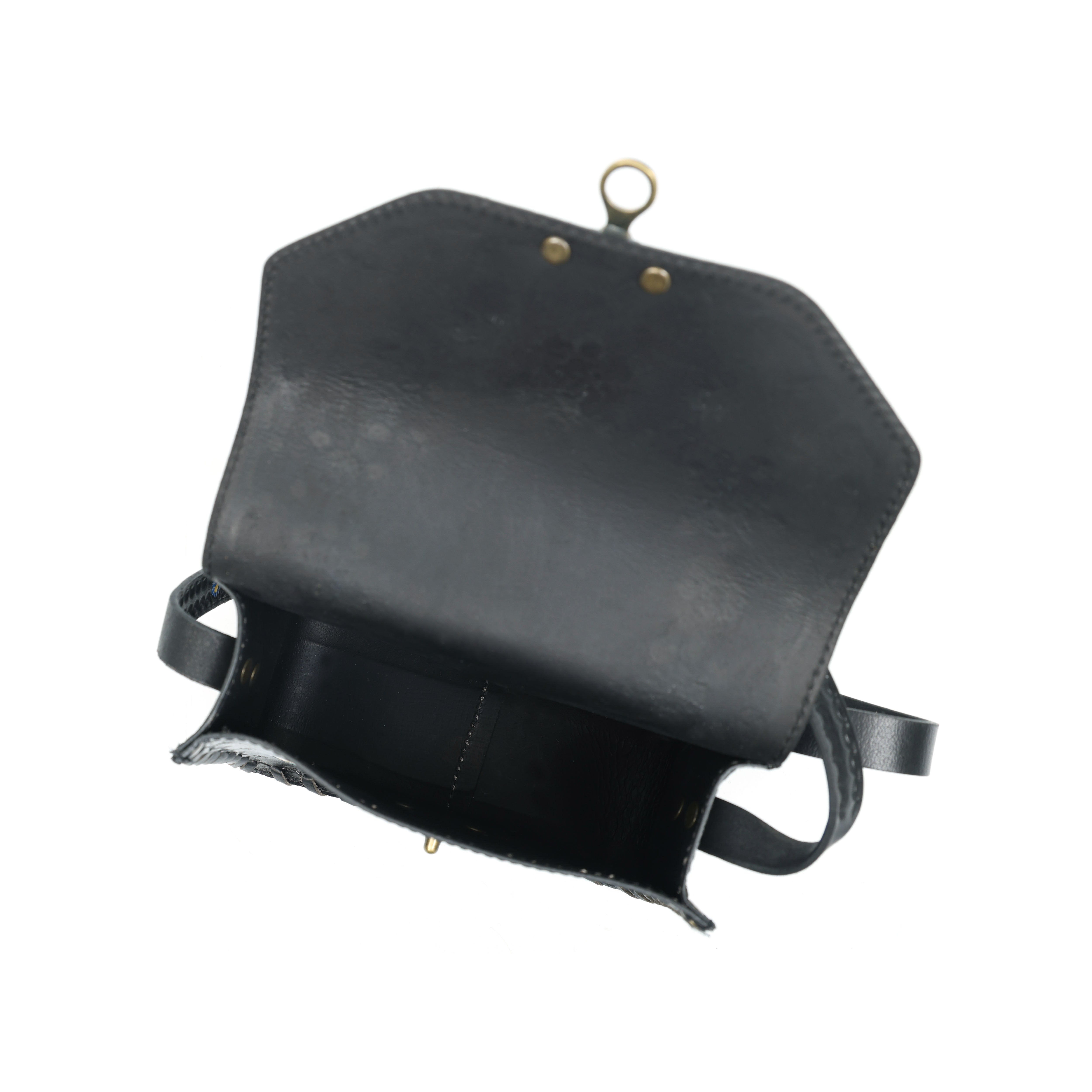 Black leather bag with strap on a white background