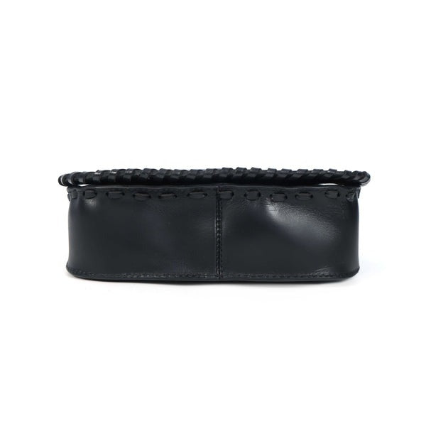 Black clutch bag with studded detail on a white background