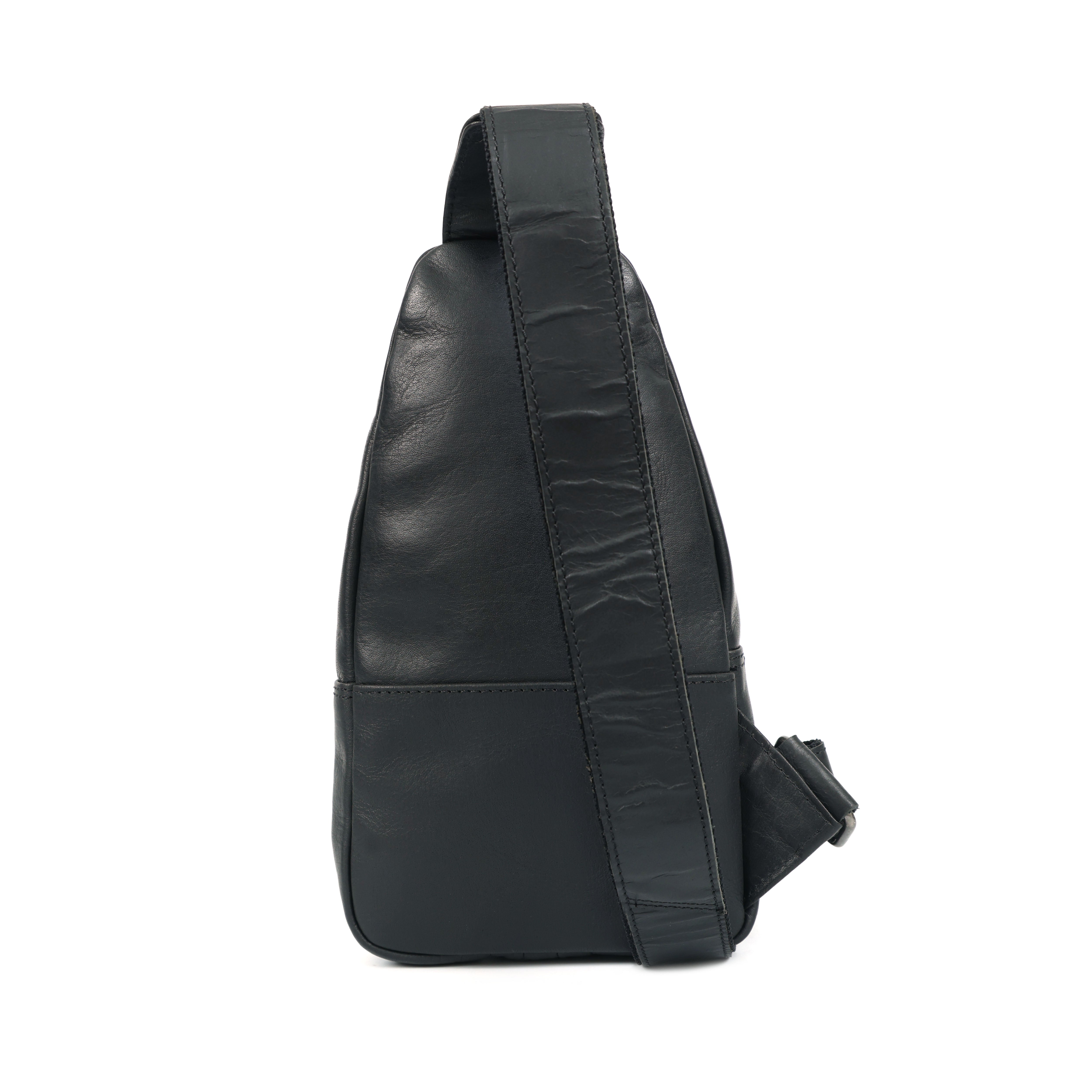 Black leather sling bag on a white background