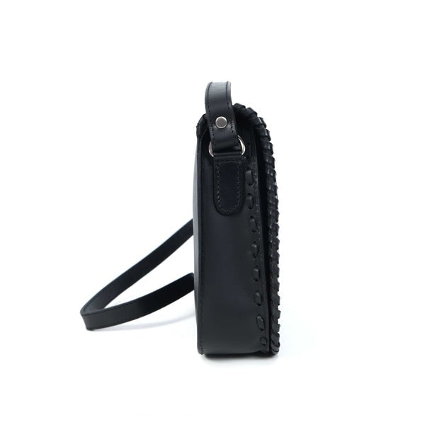 Black leather crossbody bag on a white background