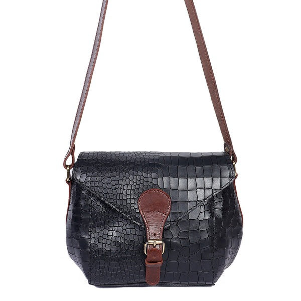 A black crocodile patterned leather sling bag with brown leather accents and a buckled flap closure.