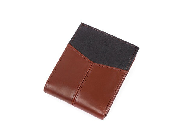 Brown leather wallet with black top section on a white background
