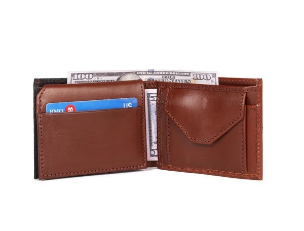 Brown leather wallet with money and cards on a white background