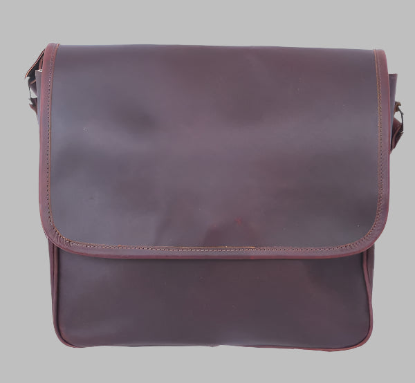 A brown leather messenger shoulder bag with a flap closure and a shoulder strap.