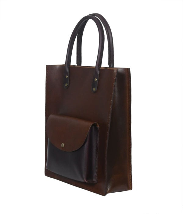 Brown leather tote bag with a pocket on a white background