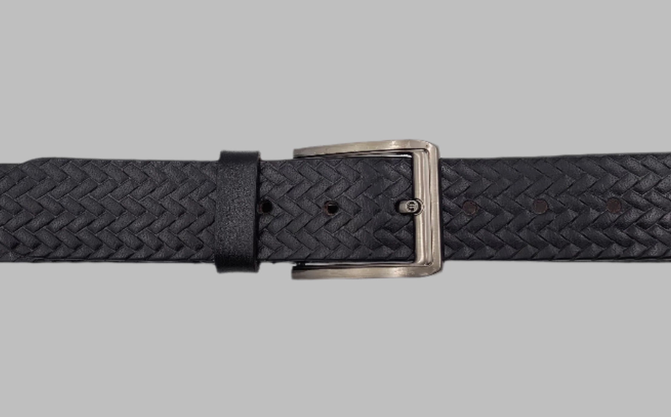 A black and brown full-grain leather belt with a metallic buckle and a checked pattern