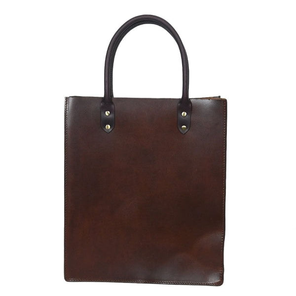 Brown leather tote bag with black handles on a white background