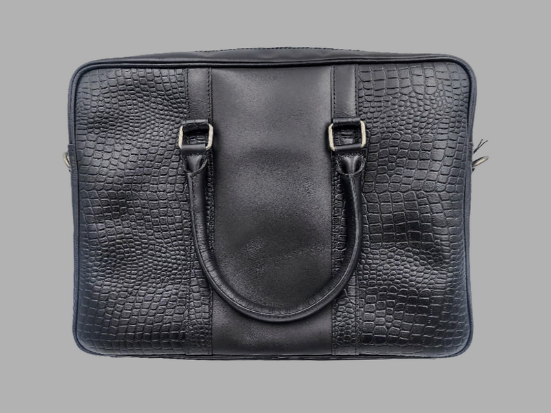 A black leather laptop bag with embossed crocodile pattern, featuring a top handle and front flap with metal hardware.