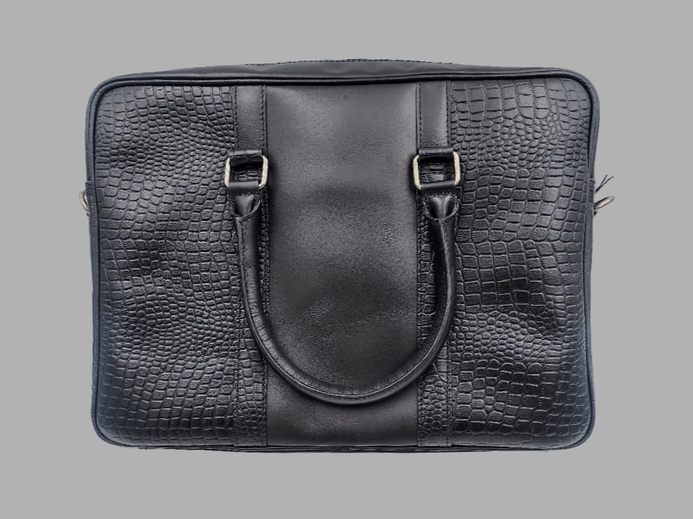 A black leather laptop bag with embossed crocodile pattern, featuring a top handle and front flap with metal hardware.