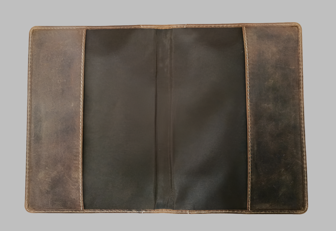 Brown leather wallet on a gray background