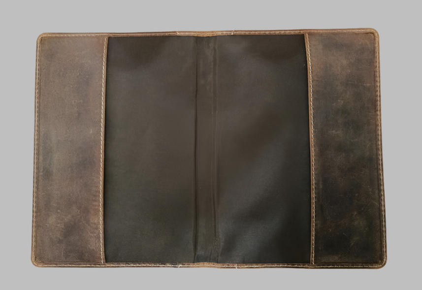 Brown leather wallet on a gray background