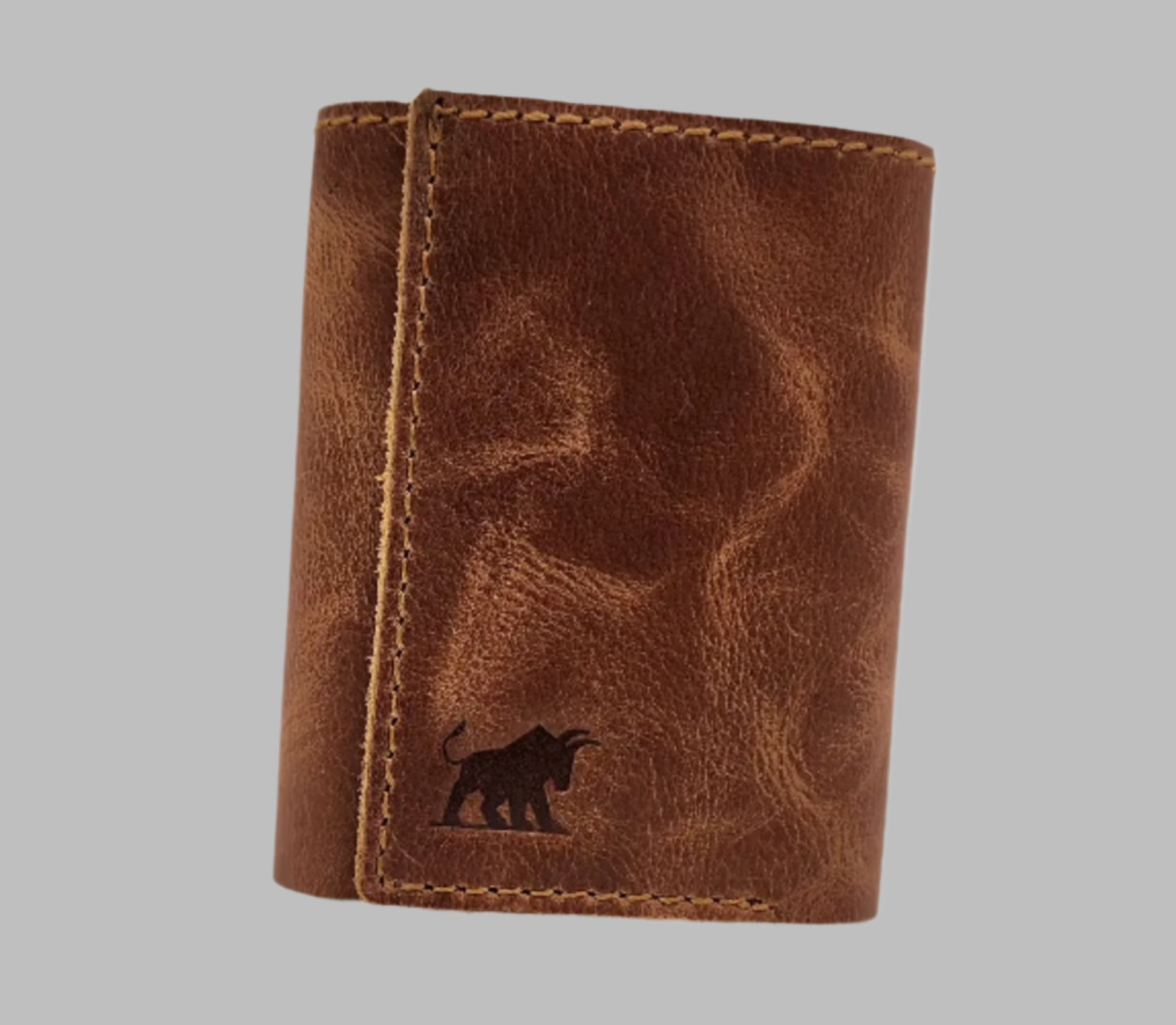 A brown leather wallet with a pop-up aluminum card case, featuring a unique design.