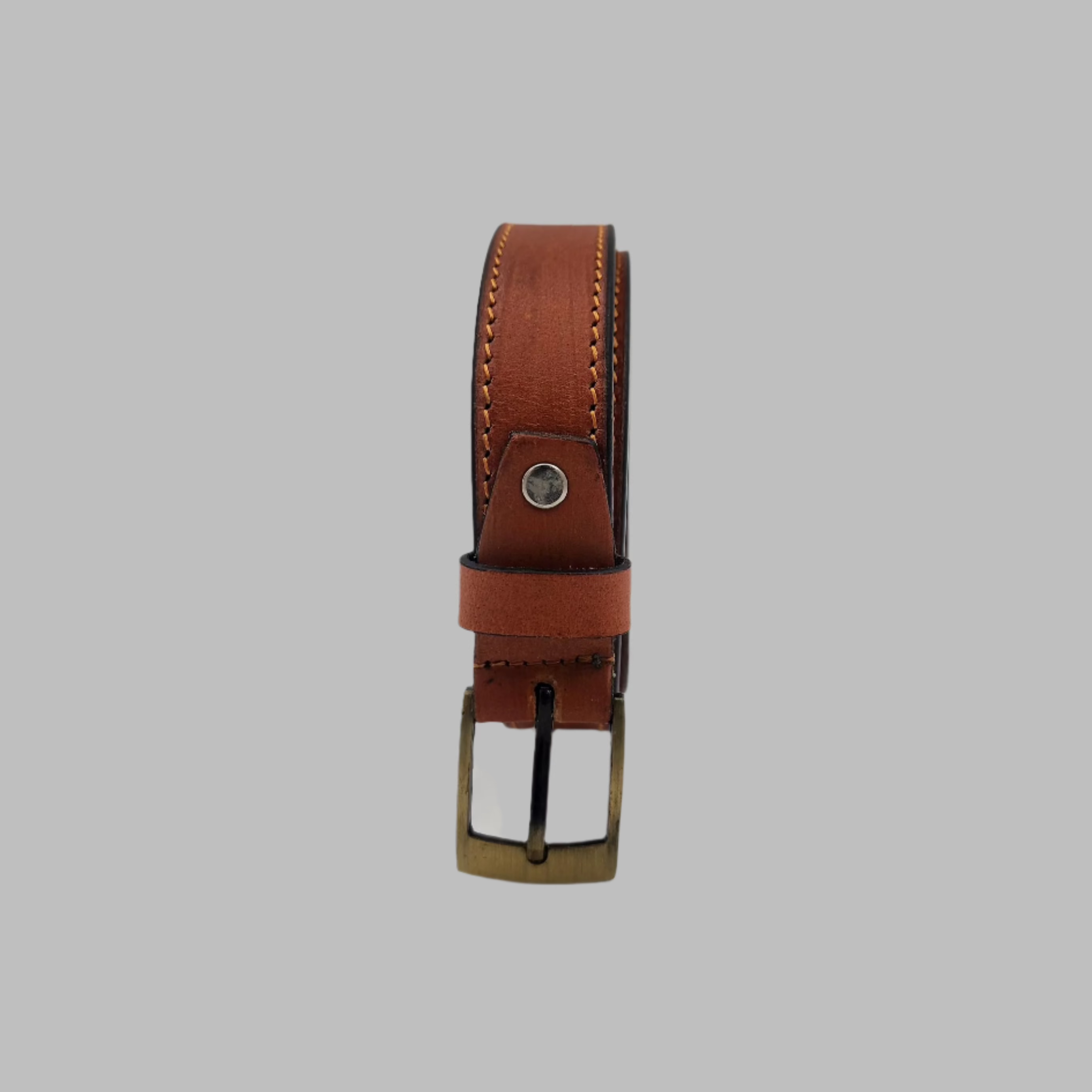 A brown ladies leather belt with a metal buckle, displayed against a white background.