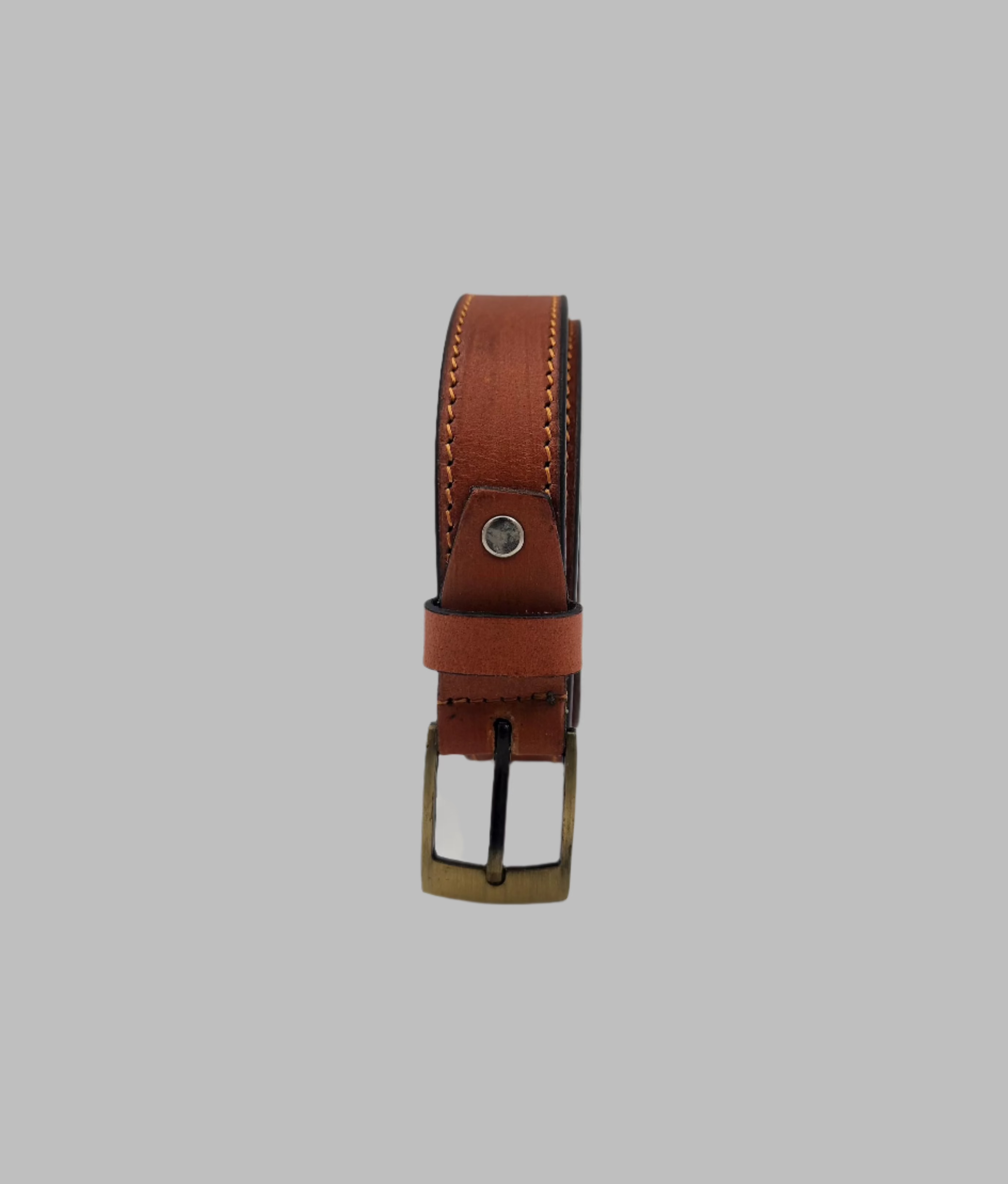 A brown ladies leather belt with a metal buckle, displayed against a white background.
