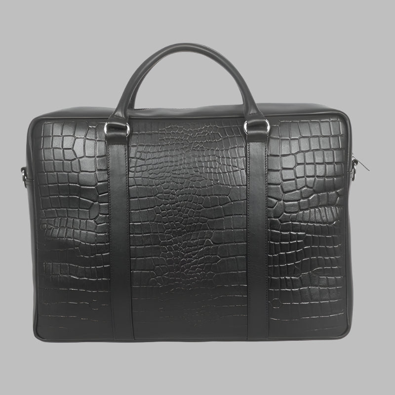 A black leather laptop bag with embossed crocodile pattern, featuring a top handle and front flap with metal hardware.