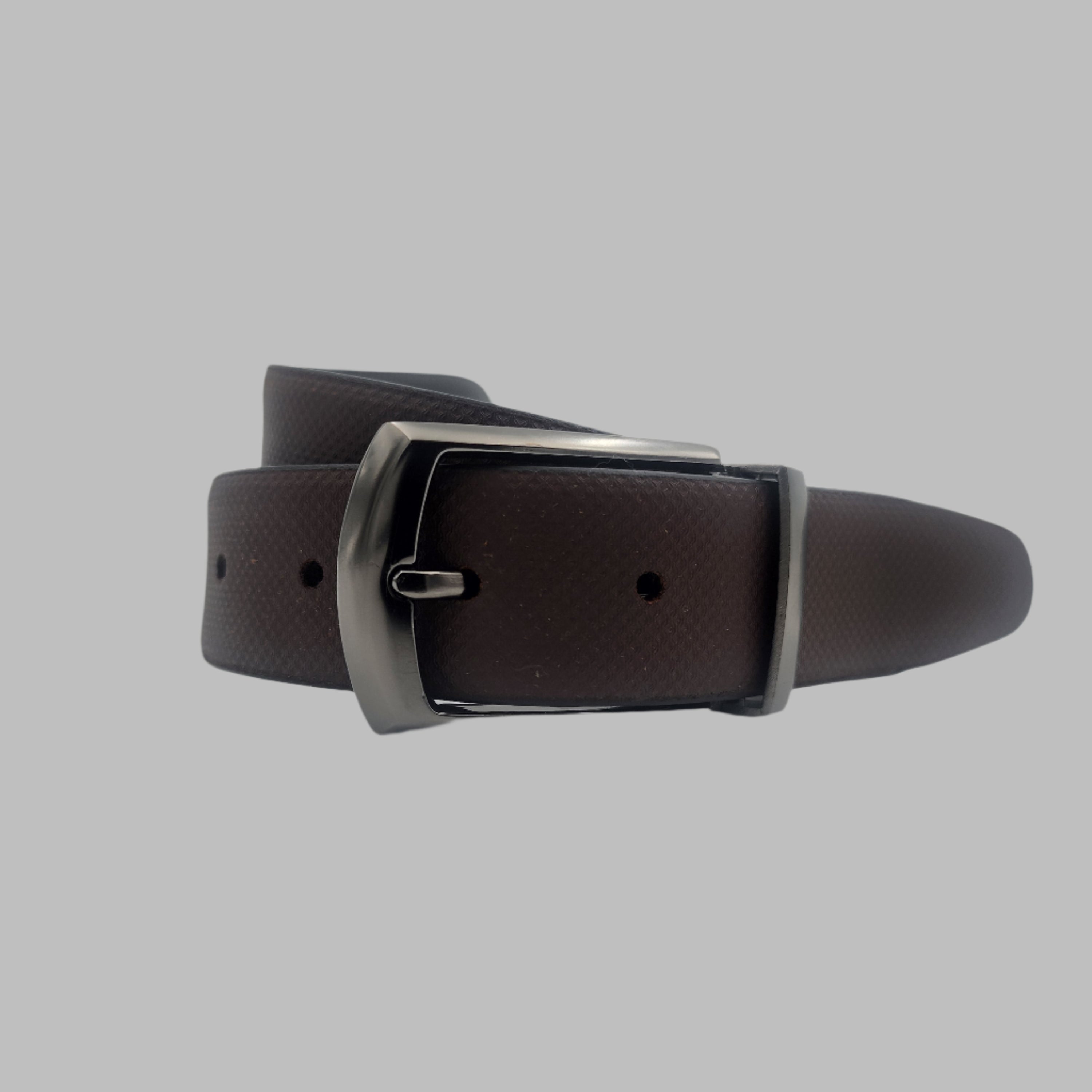A reversible leather belt with a metal buckle, featuring a black side and a brown side.