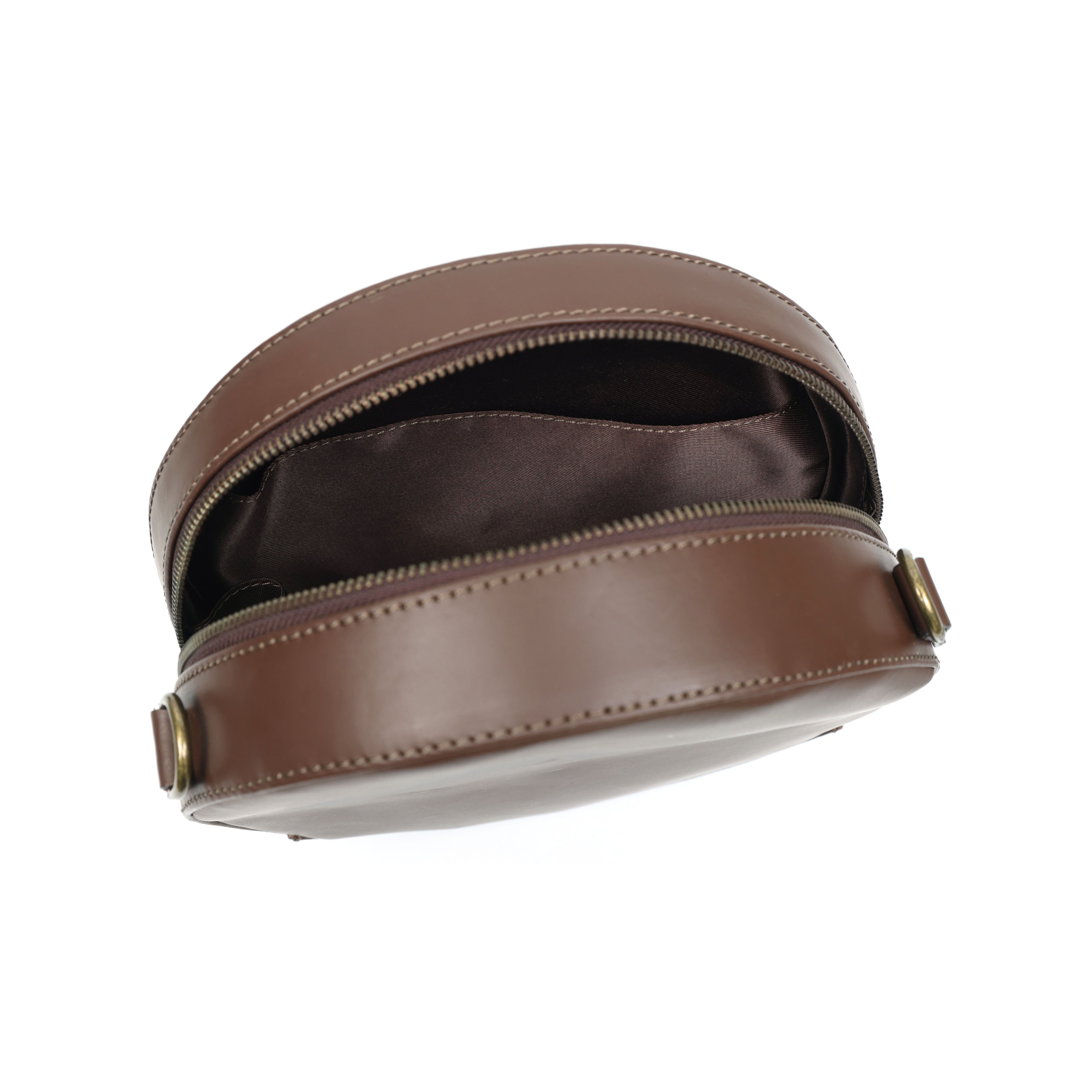 Brown leather bag with gold zipper on a white background