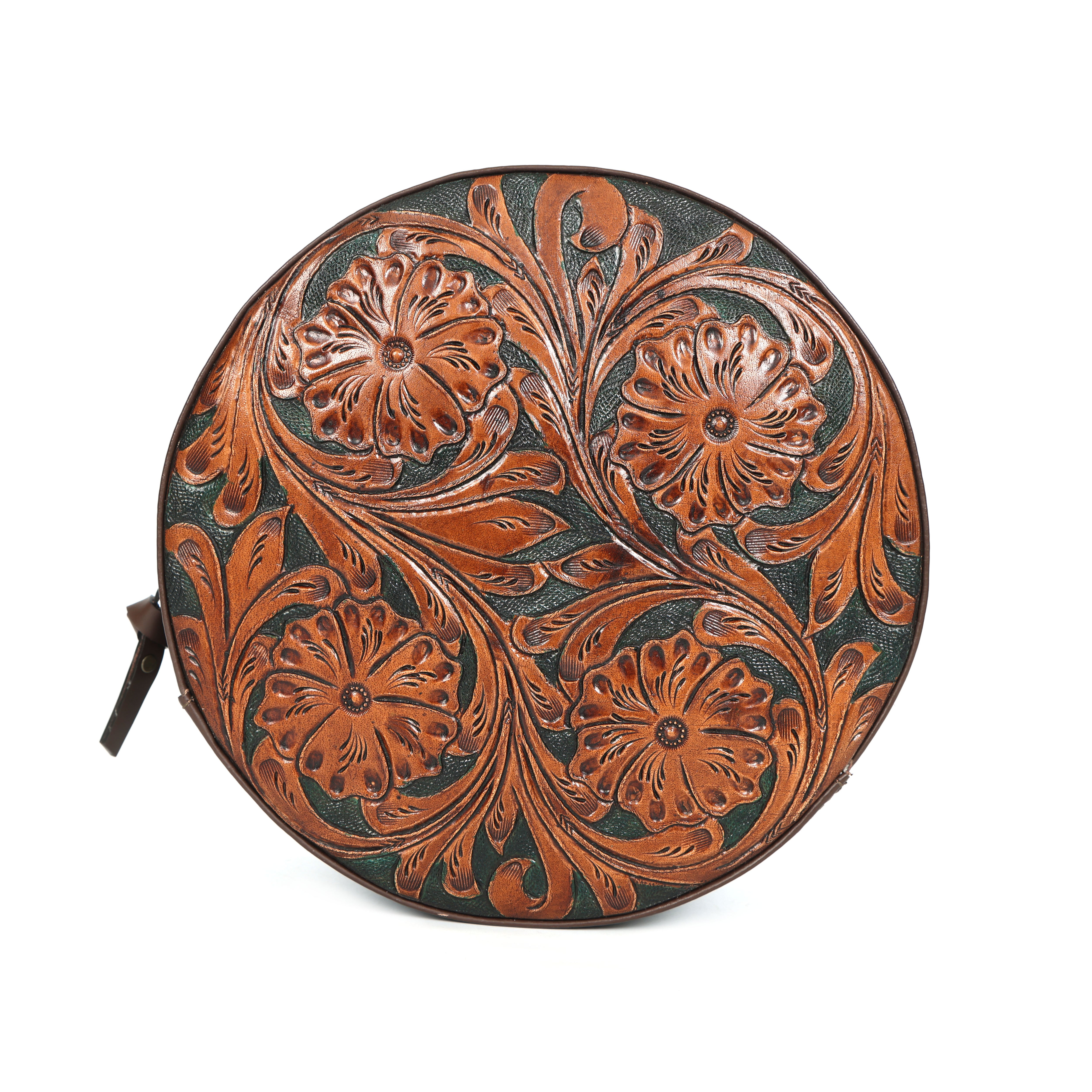 Round leather product with floral patterns on a white background