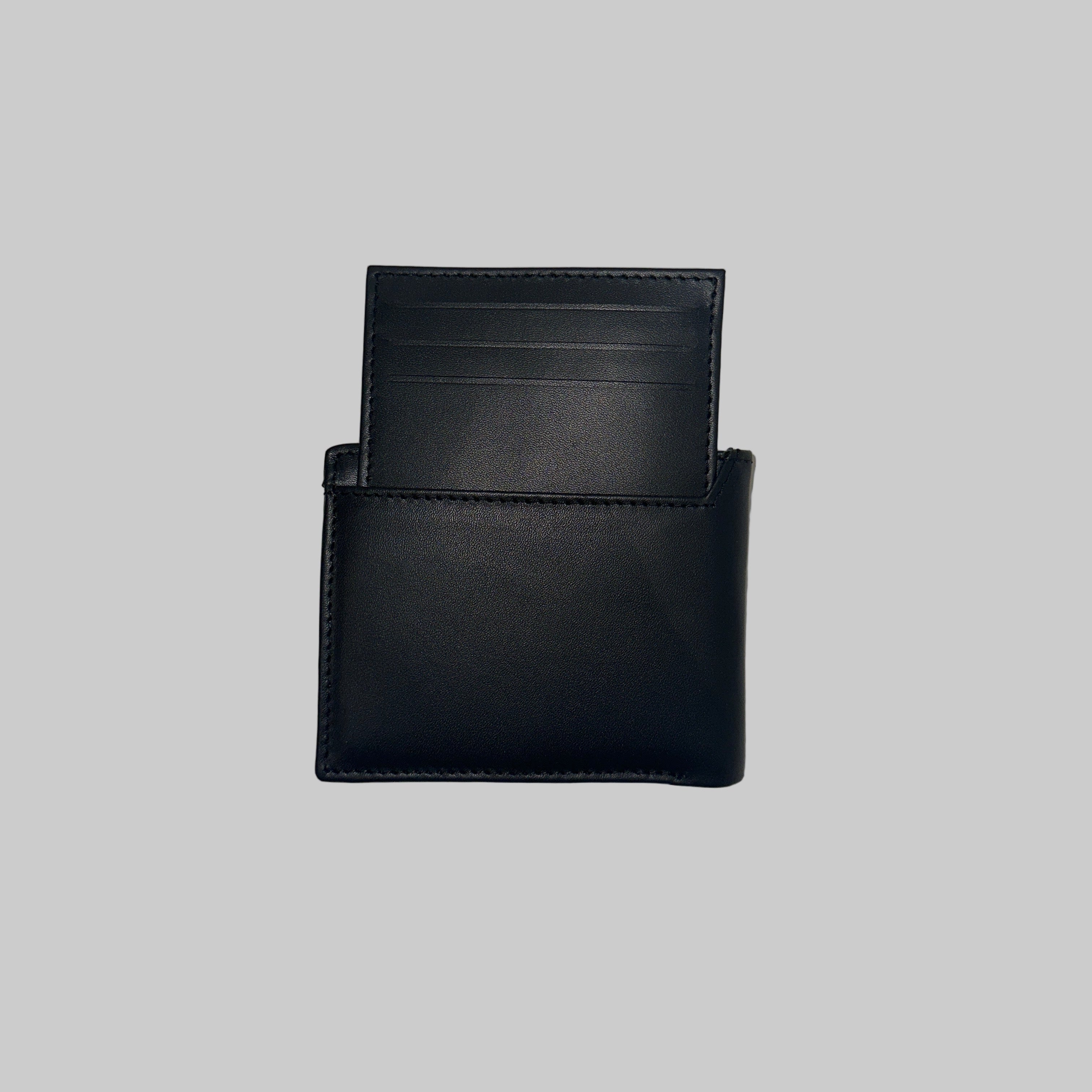 Two black leather wallets on a textured white surface