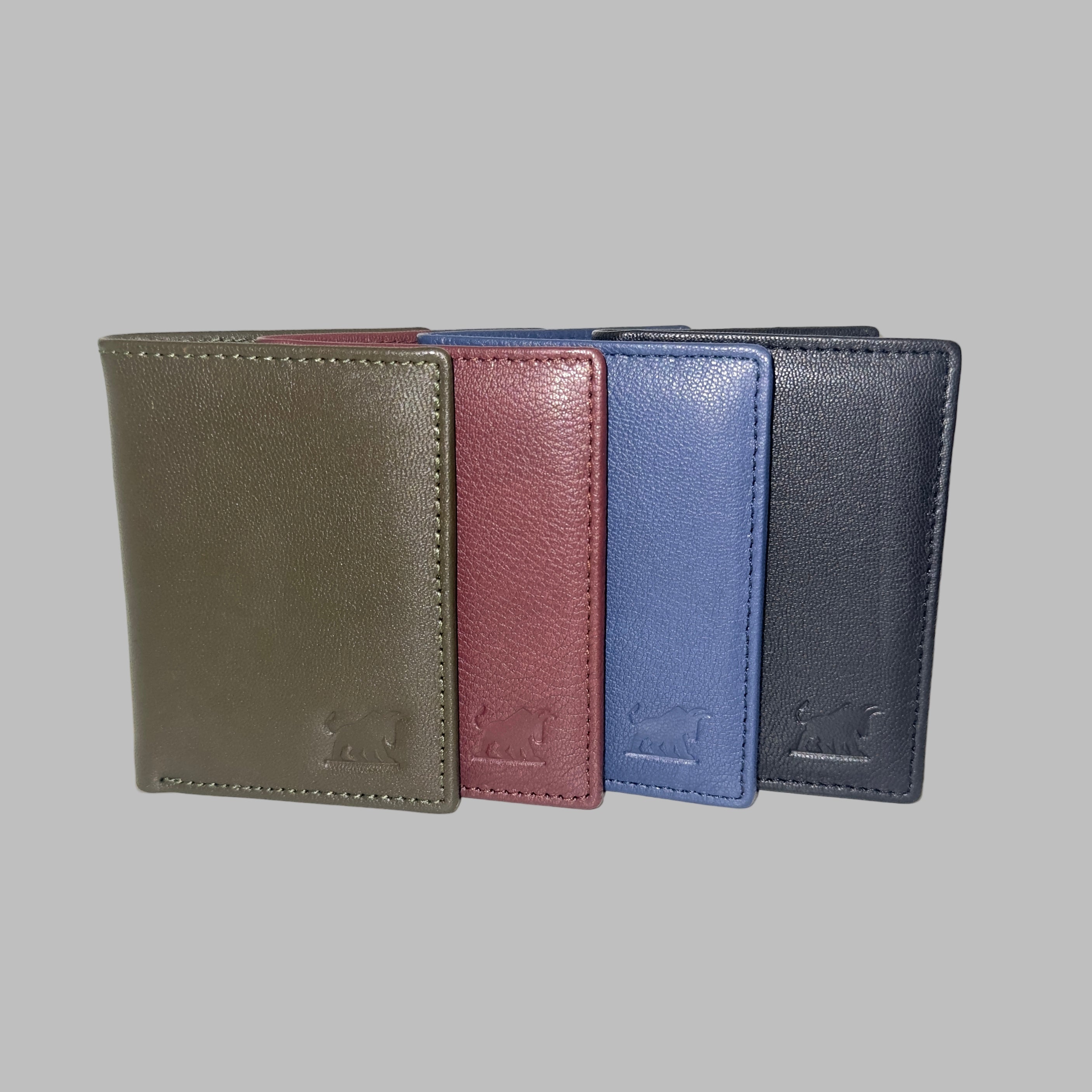 Four leather wallets in different colors arranged in a row on a white background.