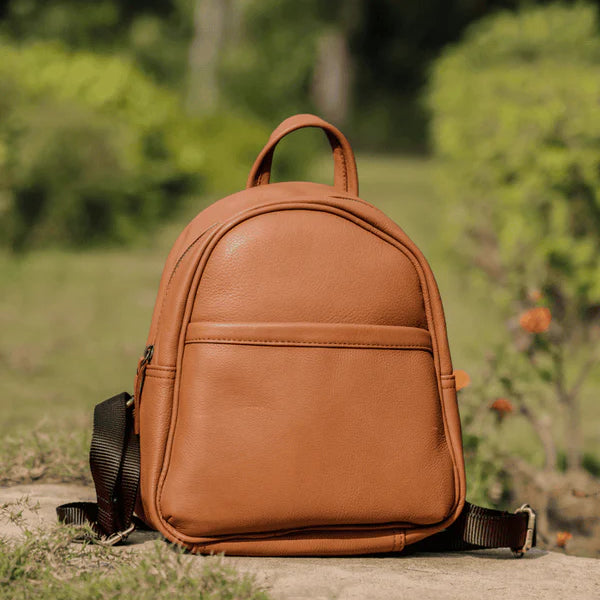 Main product photo of the Tan Small Leather Mini Backpack by GM Leather, showing a rounded top and front pocket detail. Perfect size for daily use. Available at GM Leather Auckland, New Lynn store.