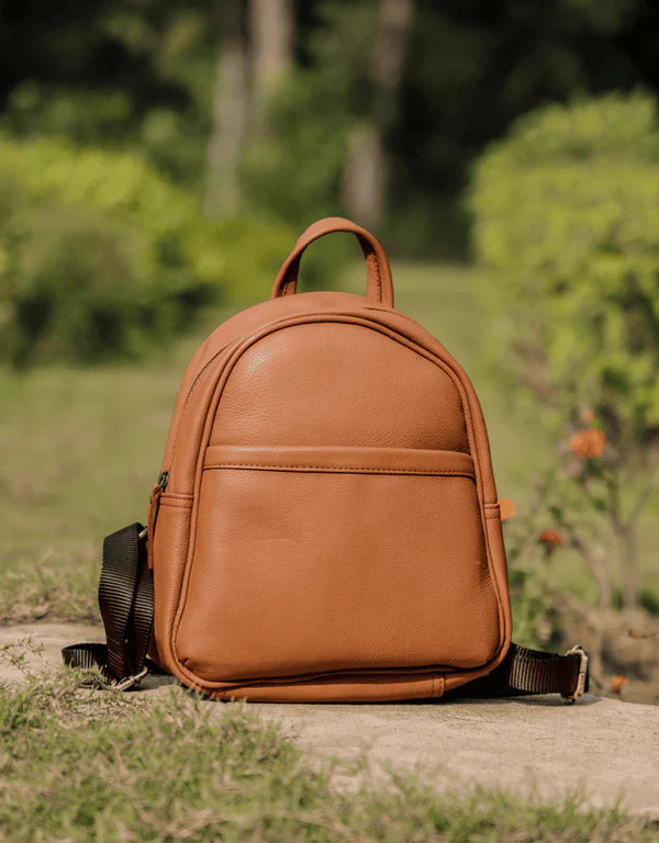 Main product photo of the Tan Small Leather Mini Backpack by GM Leather, showing a rounded top and front pocket detail. Perfect size for daily use. Available at GM Leather Auckland, New Lynn store.