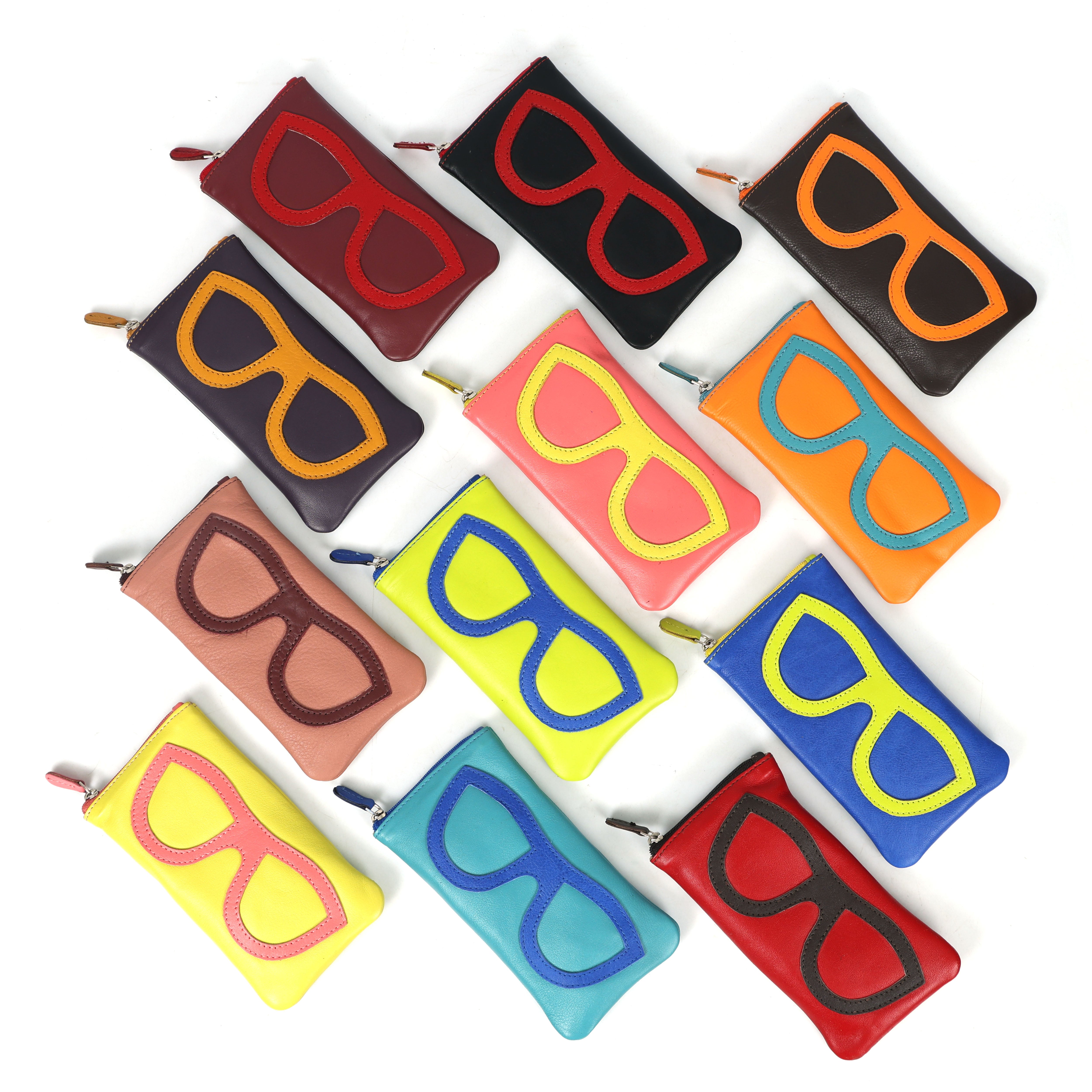 Slim leather sunglasses design wallets in vibrant and earthy tones shown from a top-down angle.