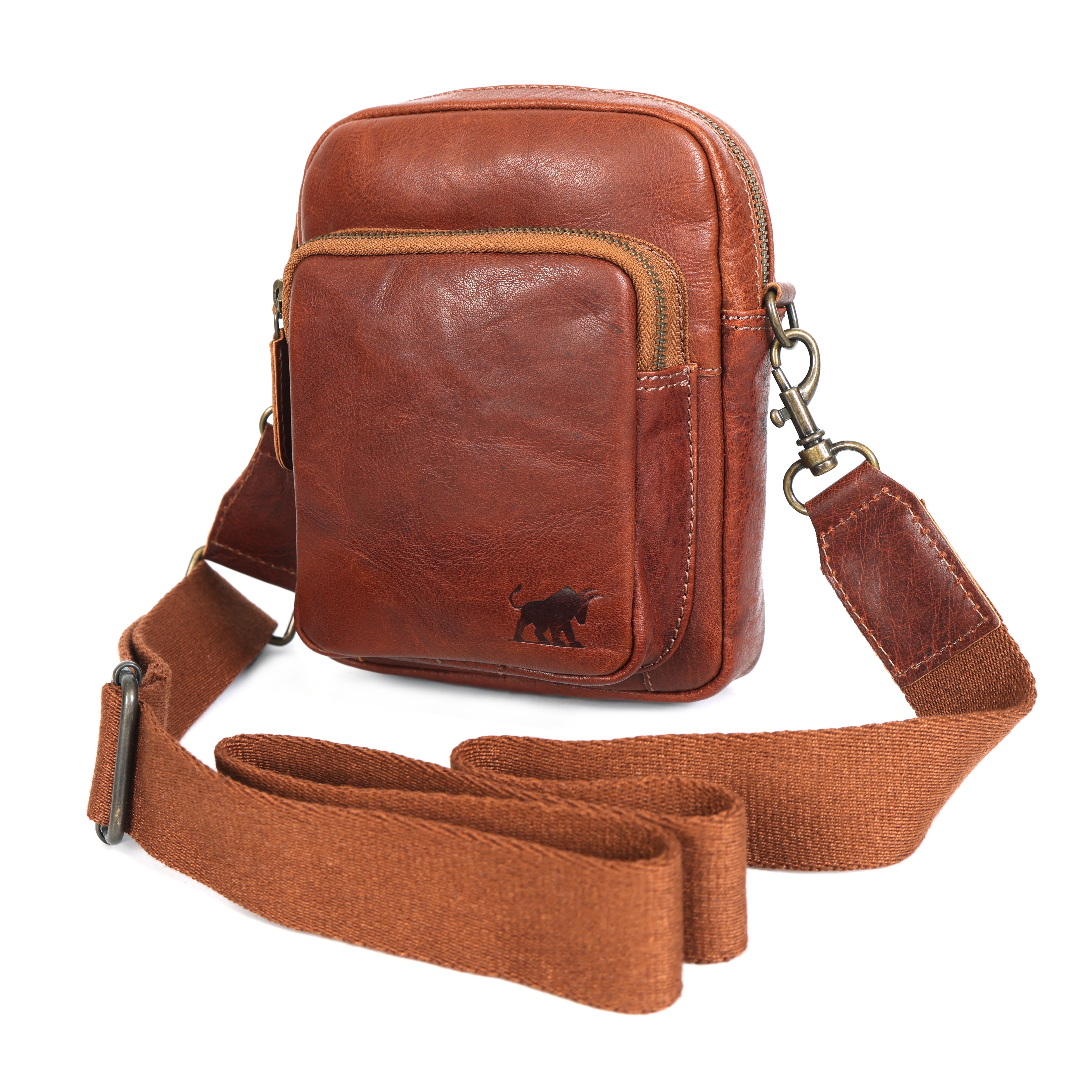 Brown full-grain leather sling bag with a zippered front pocket and a black canvas crossbody strap