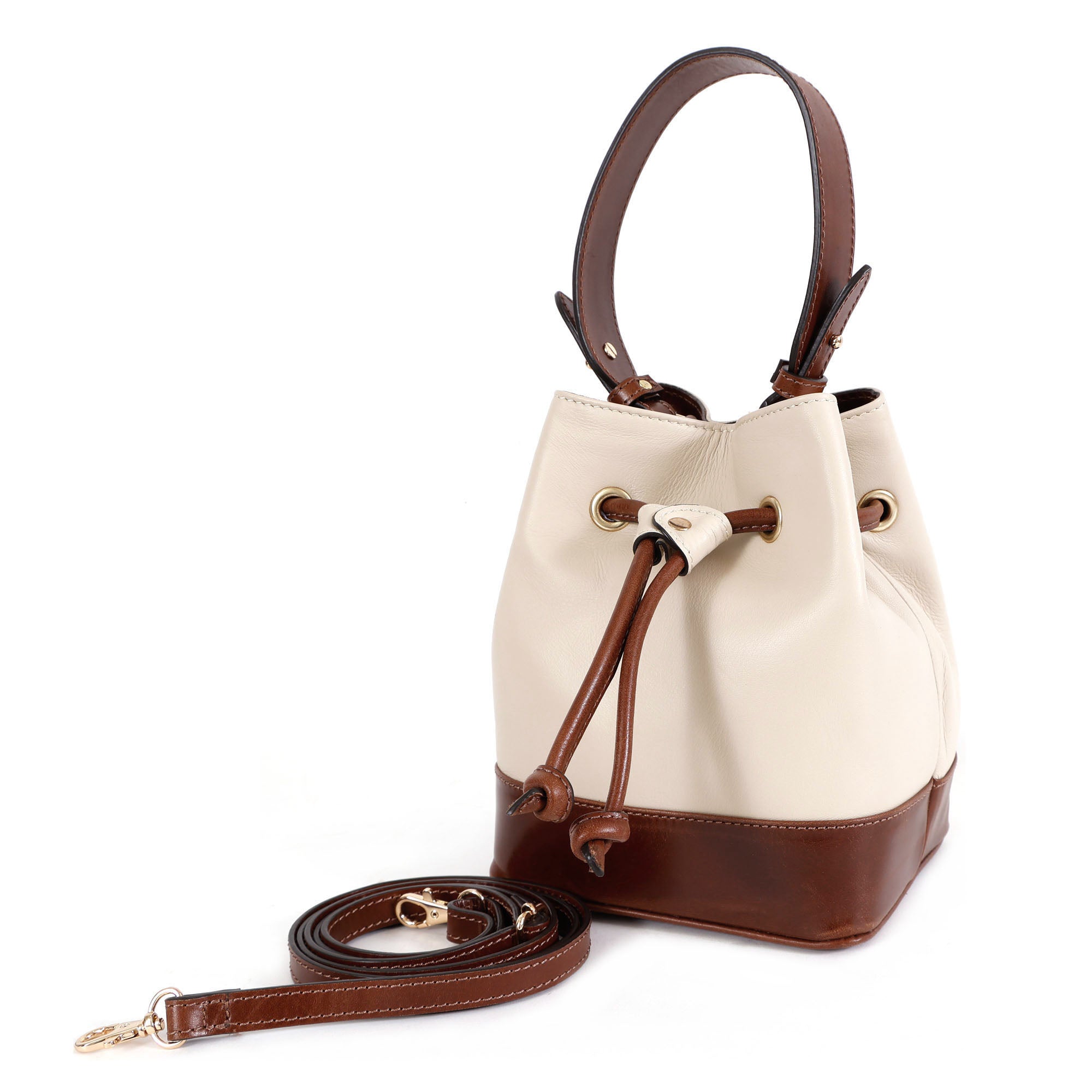 Premium cream leather bucket handbag with brown trim by GM Leather Auckland featuring adjustable strap and drawstring