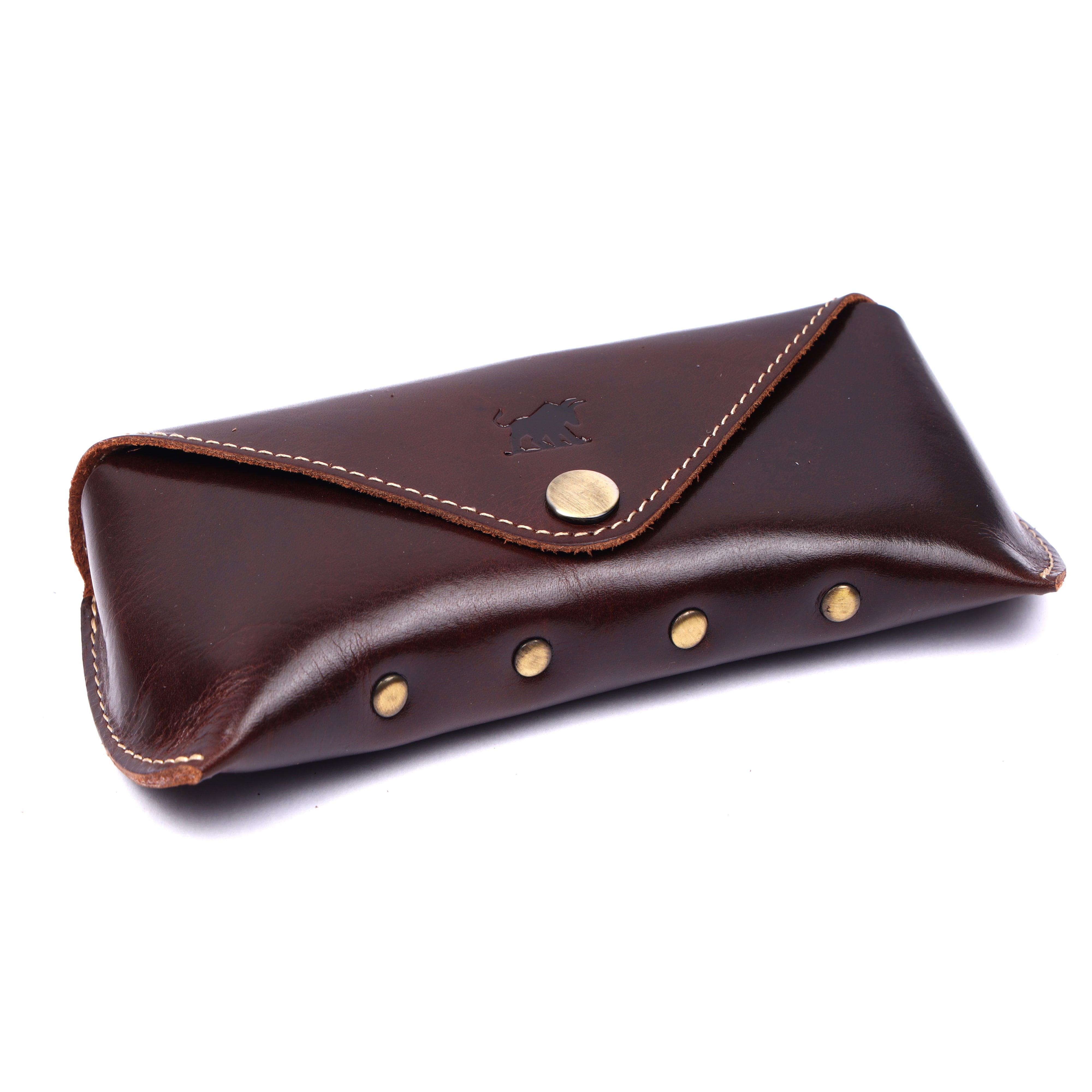 GM Leather Auckland premium leather glasses case in rich dark brown featuring an embossed bull logo and a brass snap button closure.
