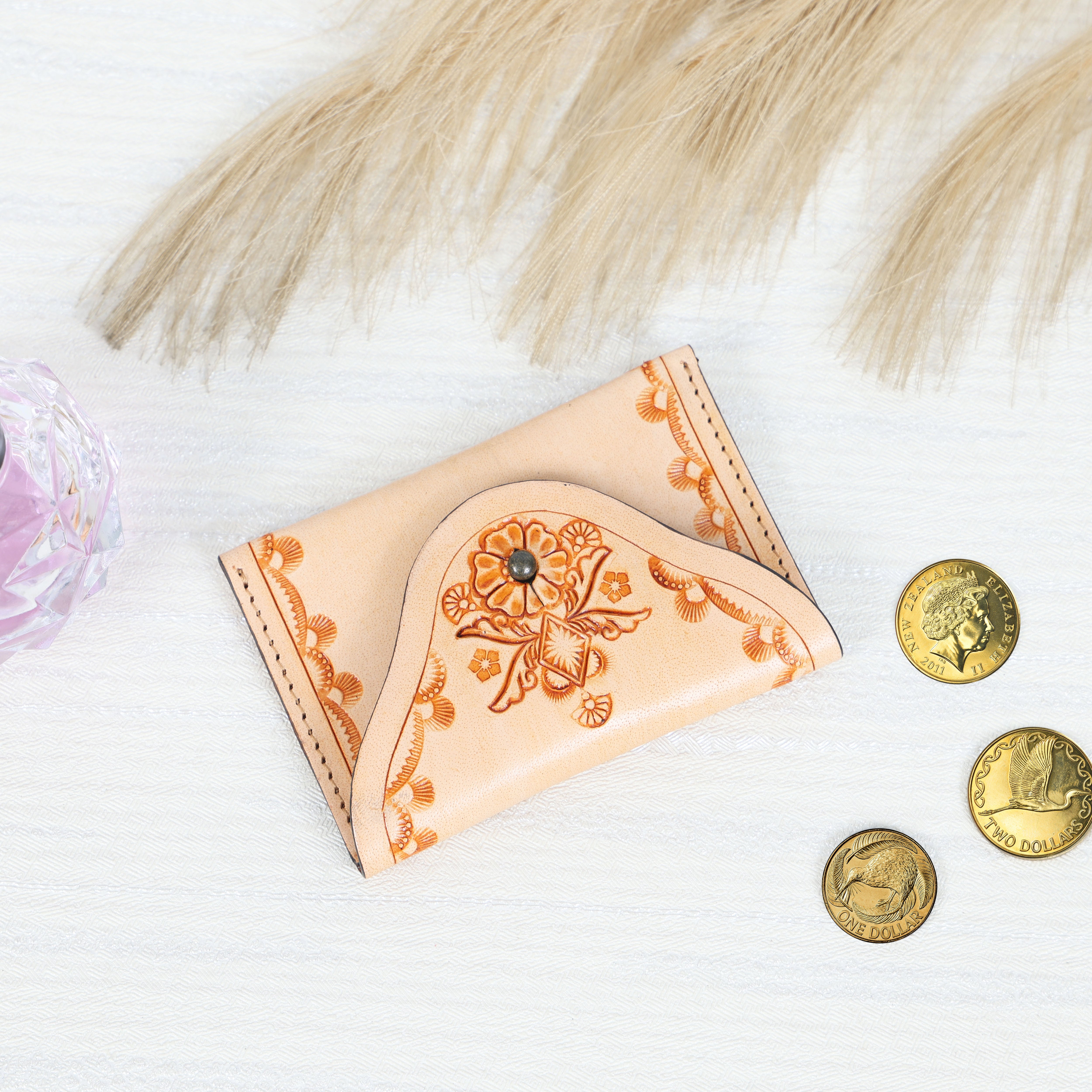 Handcrafted black genuine leather coin pouch with detailed floral embossing and snap closure by GM Leather Auckland