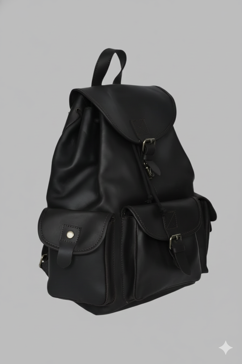 A premium GM Leather handcrafted black full grain leather backpack featuring a drawstring closure, multiple buckled pockets, and a top carry handle, available at LynnMall Auckland.