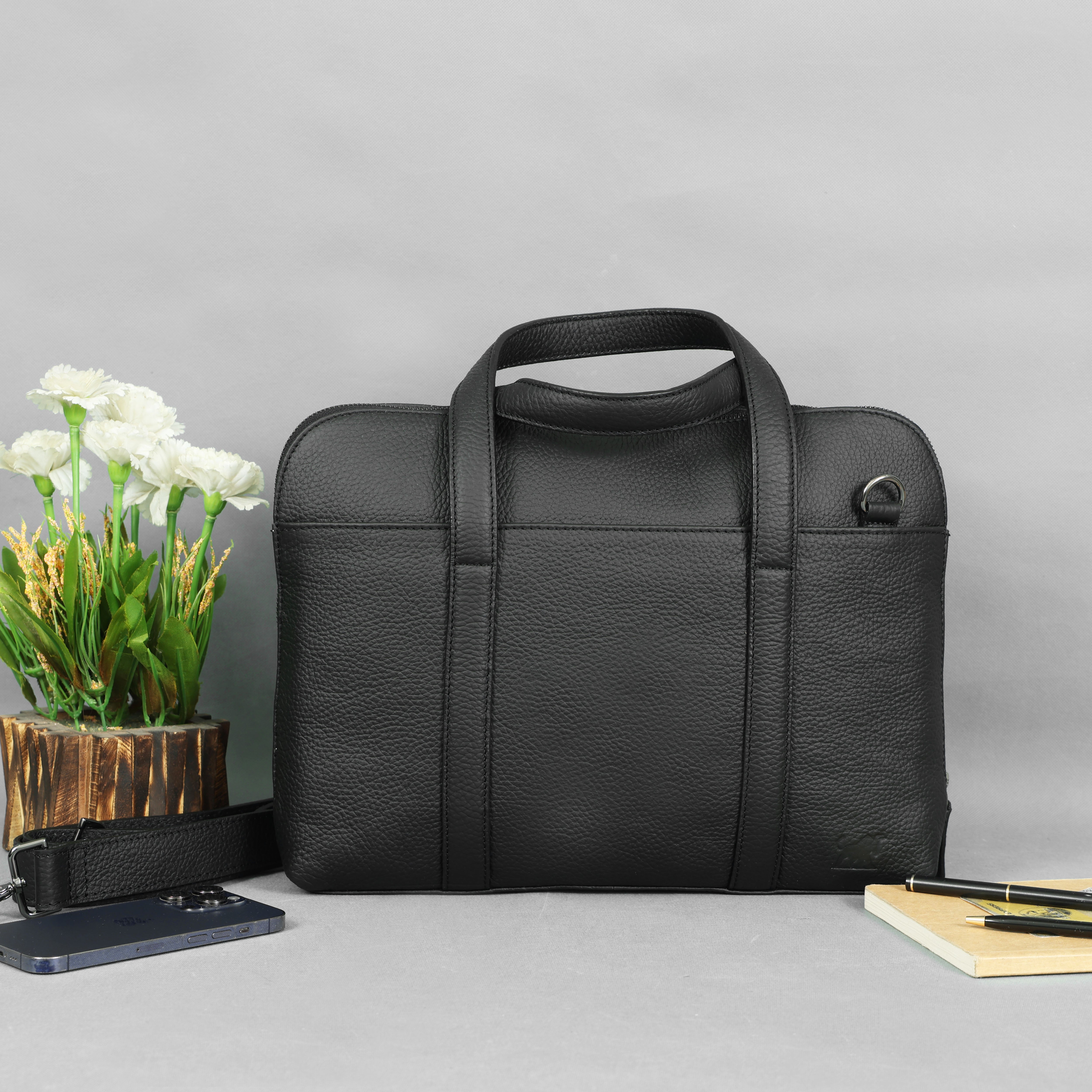 Black pebbled leather laptop briefcase with a detachable shoulder strap and classic plaid fabric lining, by GM Leather Auckland