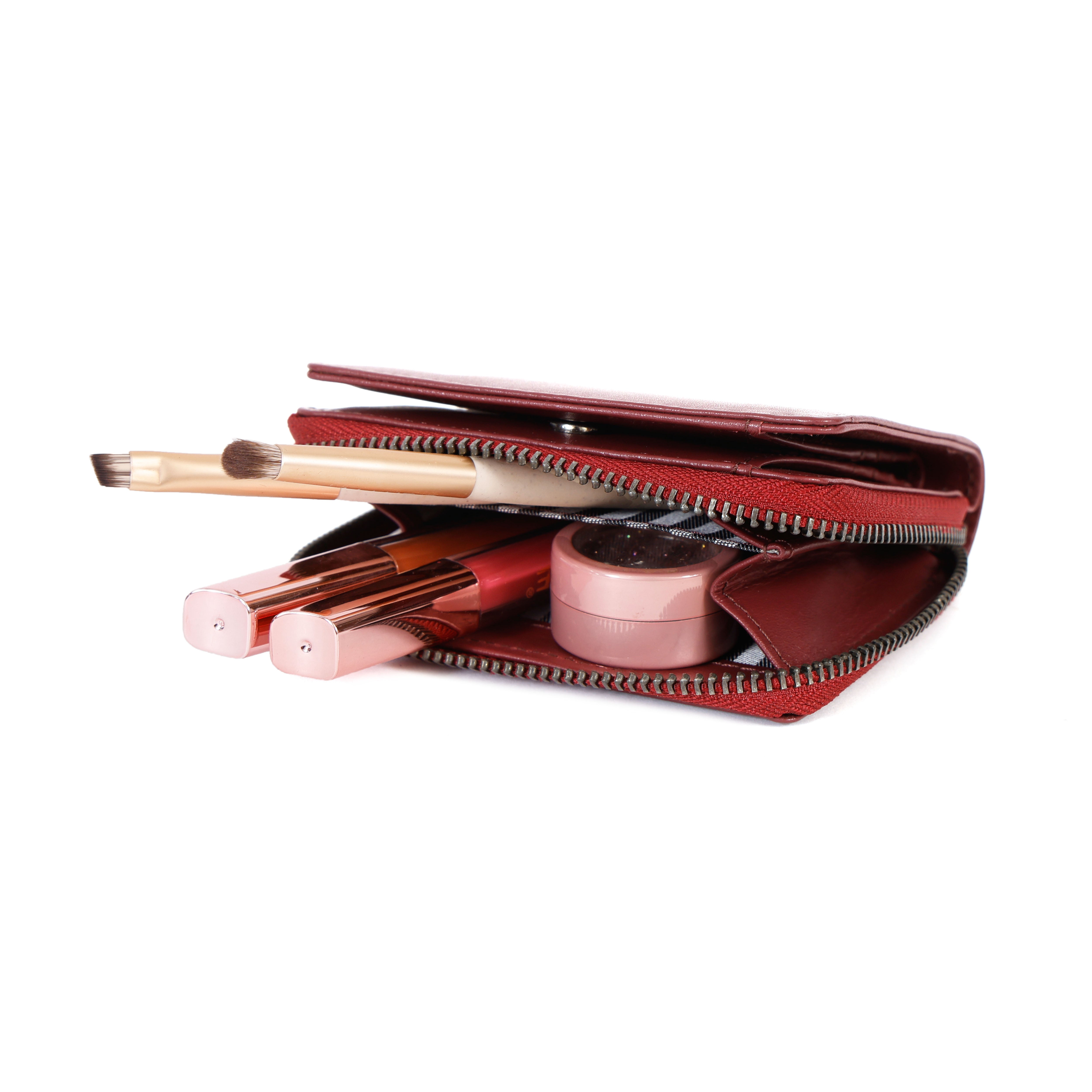 Internal view of GM Leather bifold clutch wallet with credit card holder slots and a New Zealand fifty dollar note inside the currency compartment as seen