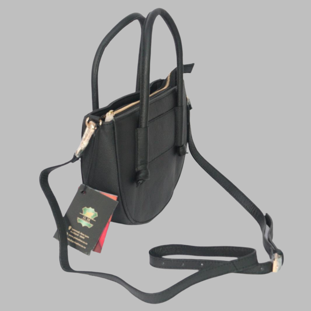 GM Leather dark green half-moon crossbody bag with top handles and adjustable strap, handcrafted in Auckland.