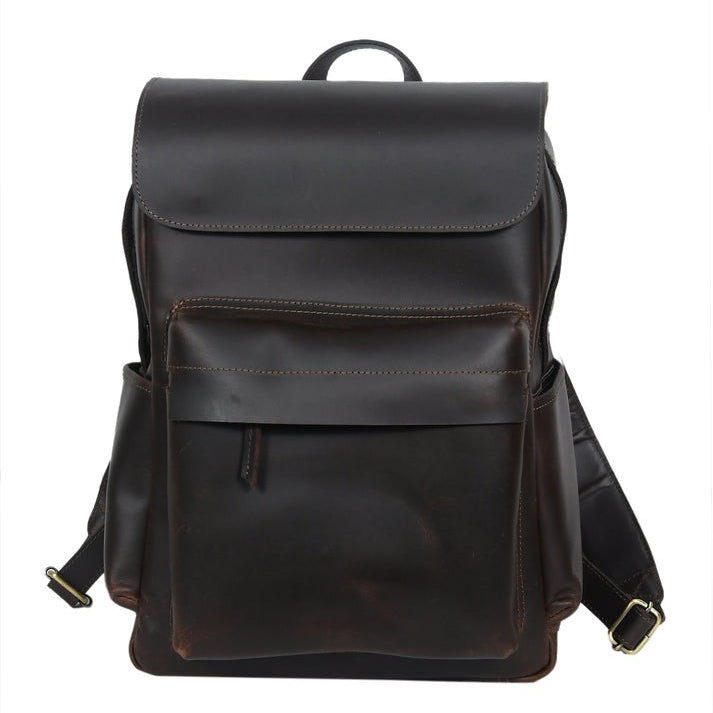 A premium GM Leather handcrafted dark brown leather backpack with a large front pocket and padded laptop interior, available at the LynnMall shop in Auckland.