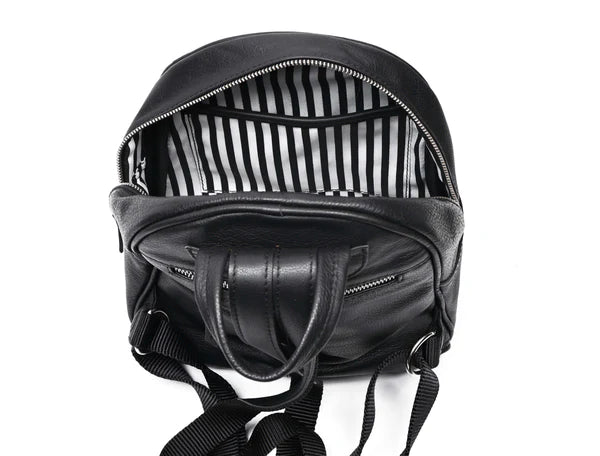 A premium GM Leather handcrafted two-tone brown leather backpack with a drawstring top and buckle closure, available at the LynnMall shop in Auckland.