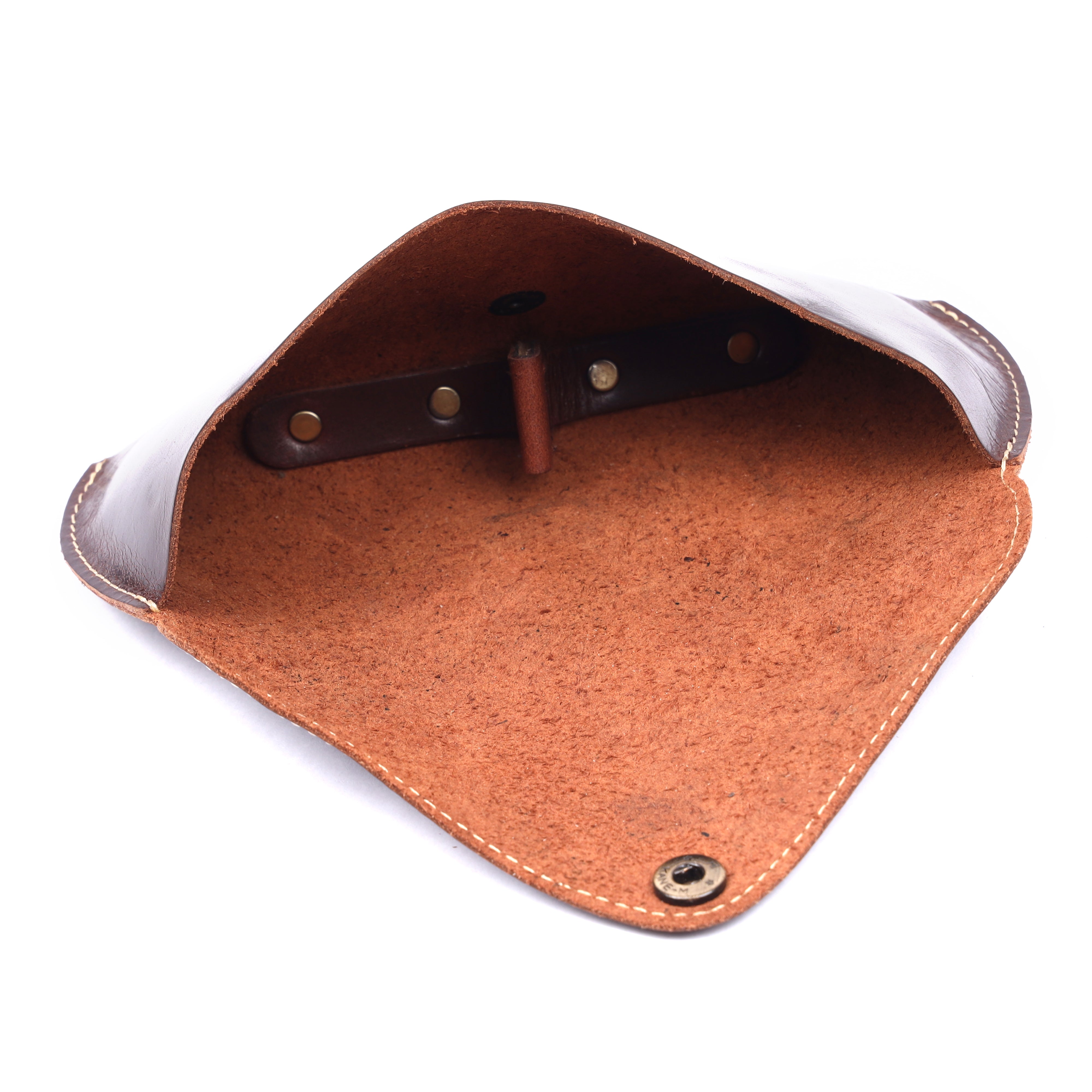 Angled studio perspective of the dark brown handcrafted genuine leather sunglasses pouch showing contrast stitching and brass rivet base accents.