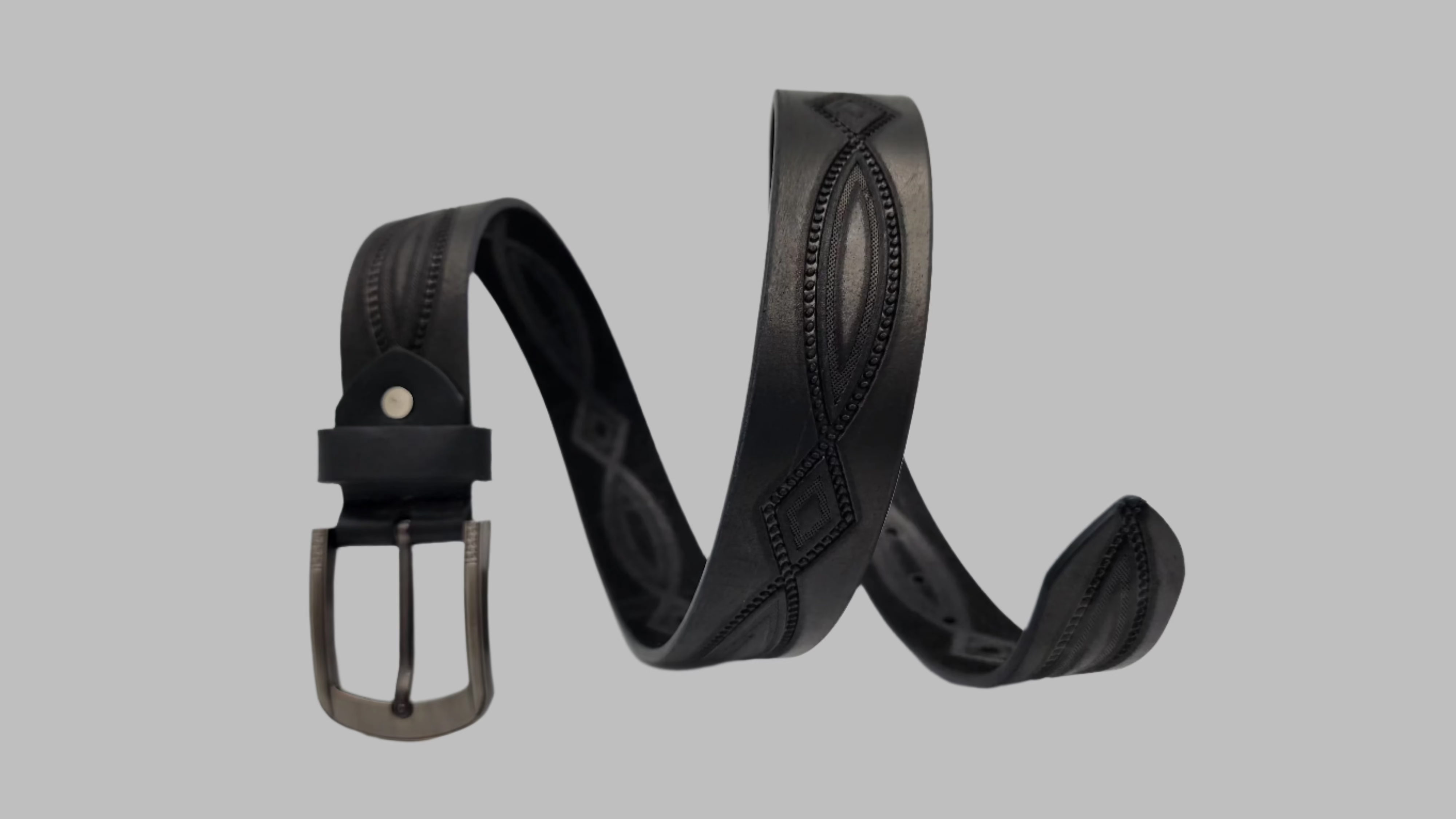 Black Embossed Pattern Leather Belt for men from GM Leather Auckland, featuring a diamond and scrolling design with a classic silver metal buckle.