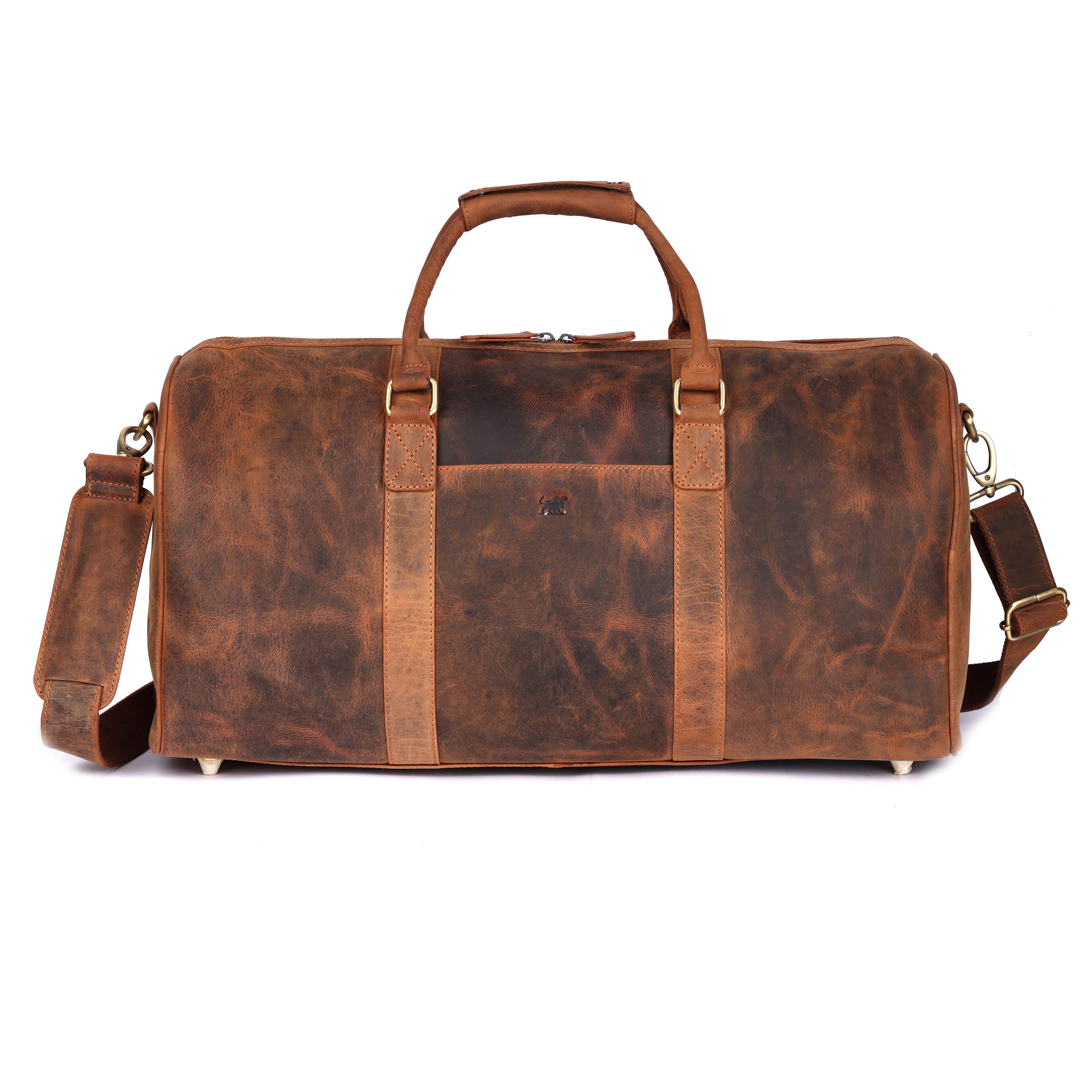 Three-quarter front view of the GM Leather tan weekend travel holdall, showcasing its rugged pull-up leather texture and robust silhouette