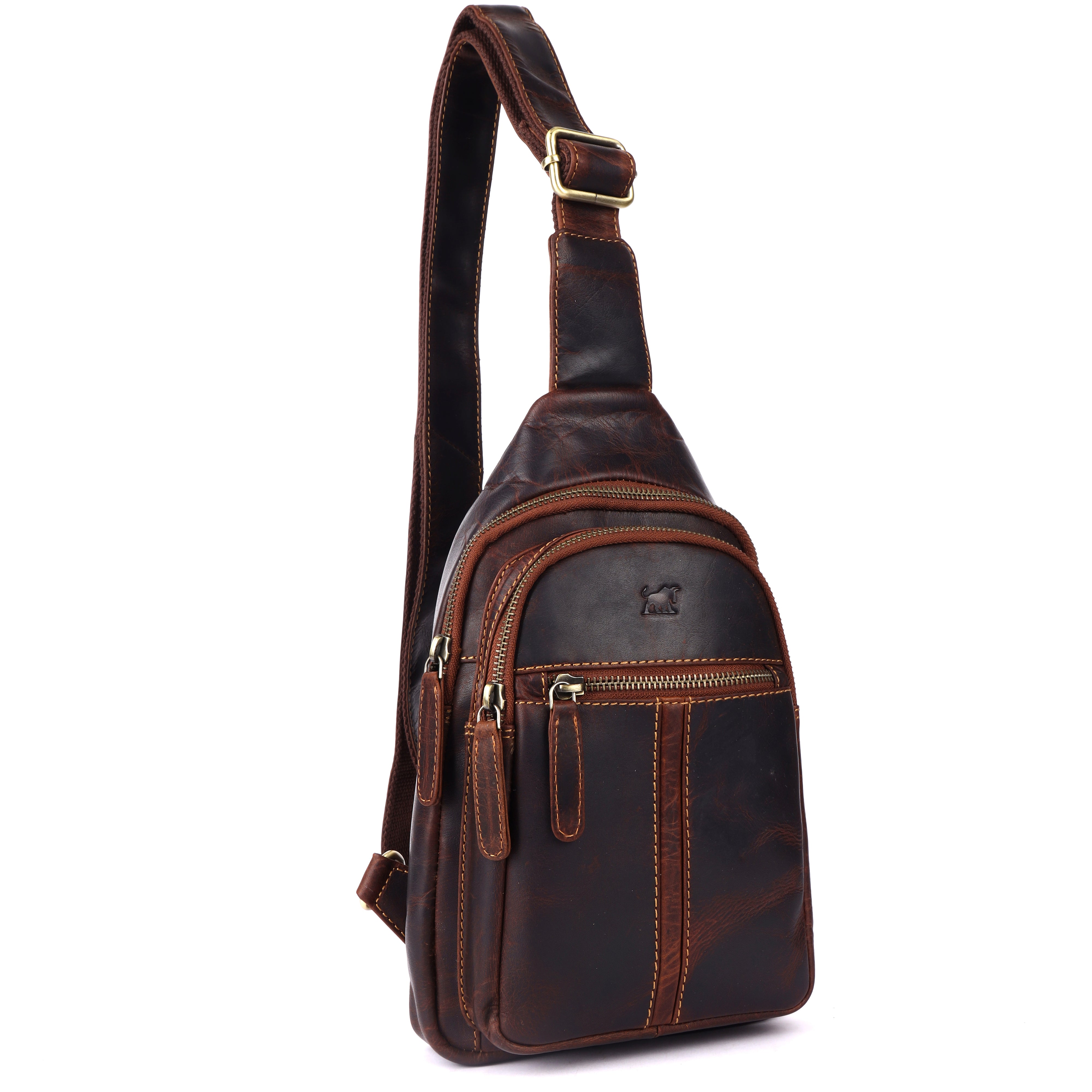 GM Leather Sling Bag styled with essential items (phone, wallet, keys) showing capacity and use case.