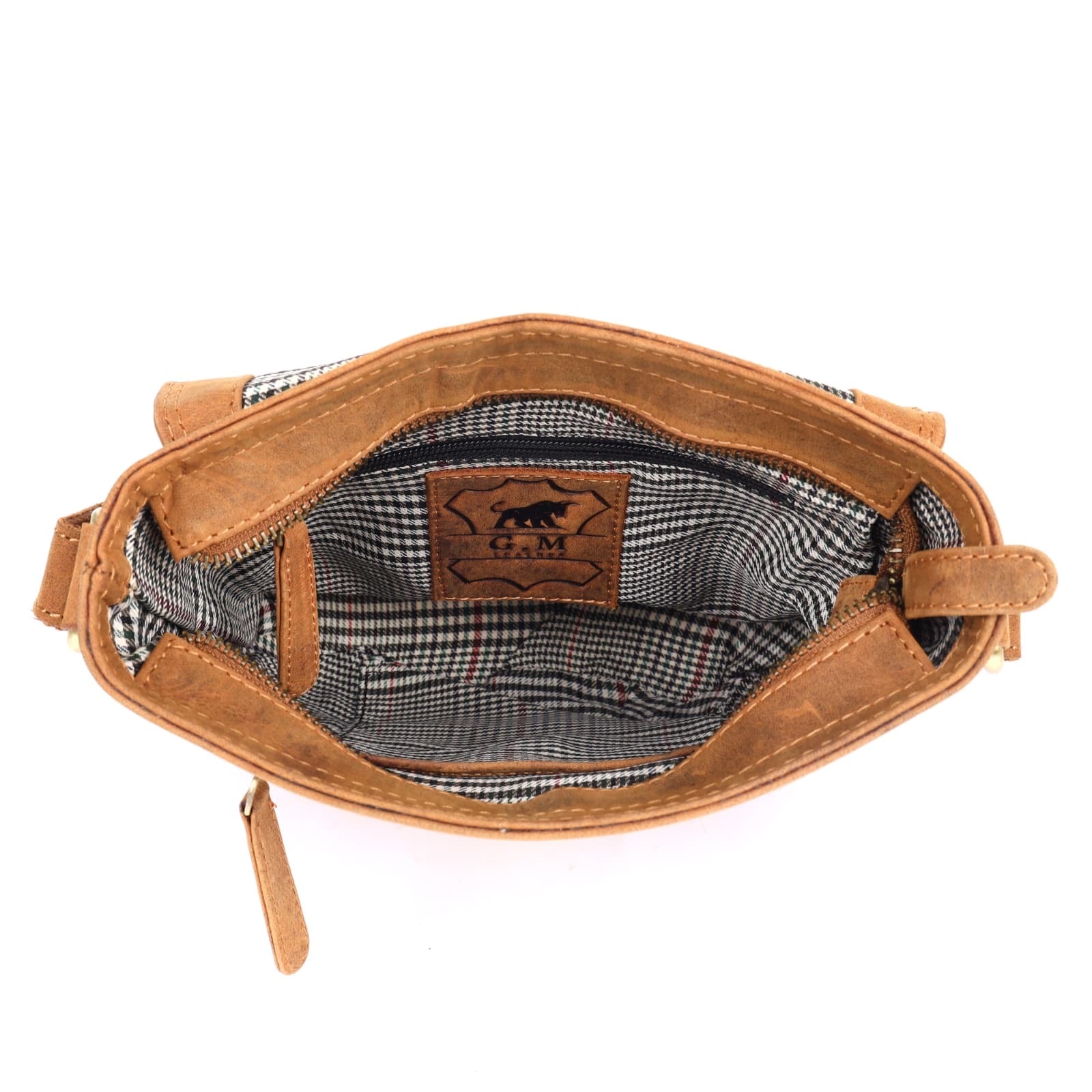 Interior view of tan full-grain crossbody bag with checked lining by GM Leather Auckland, showing pockets and craftsmanship details.