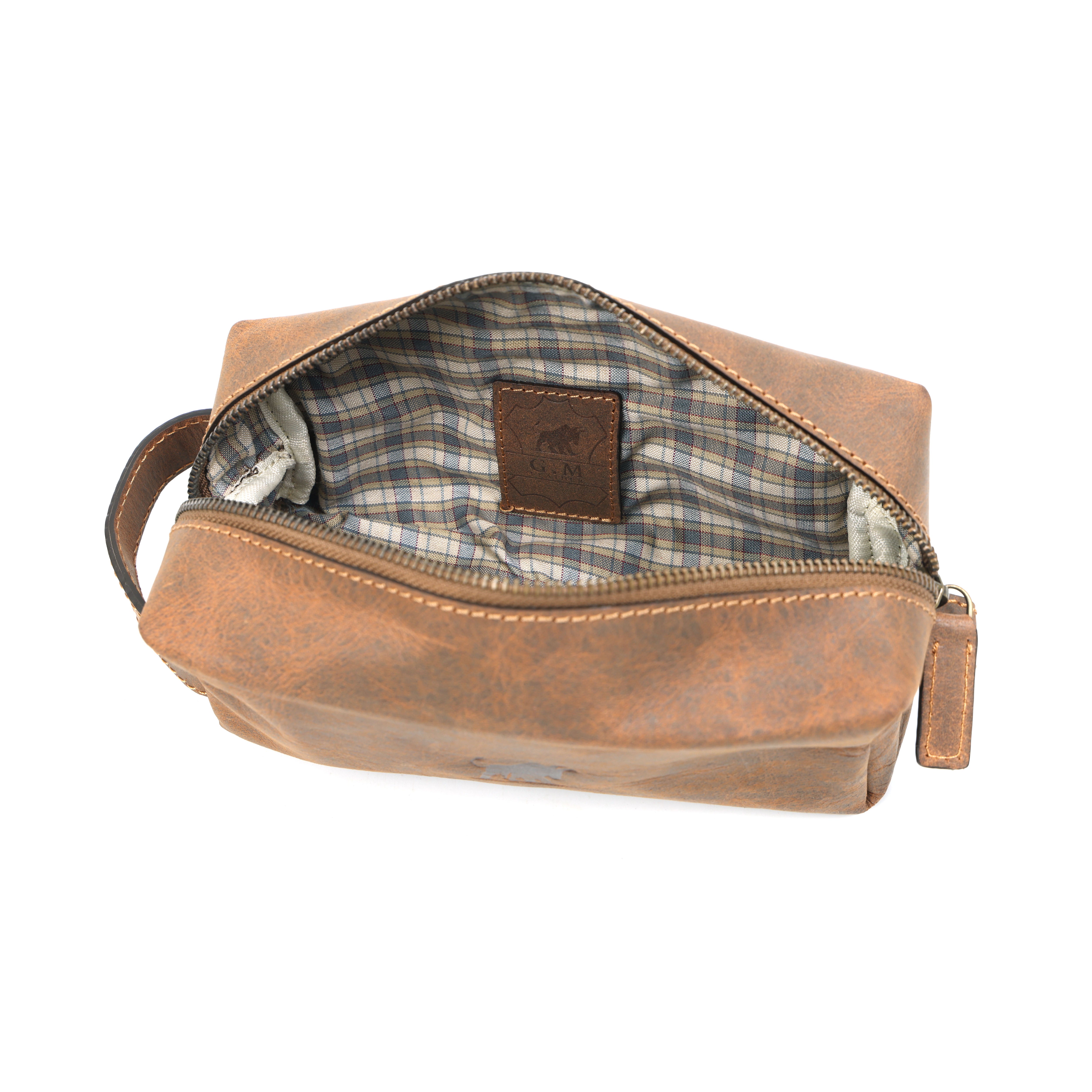 GM Leather toiletry bag showing checkered lining and authentic leather brand patch, LynnMall New Lynn.