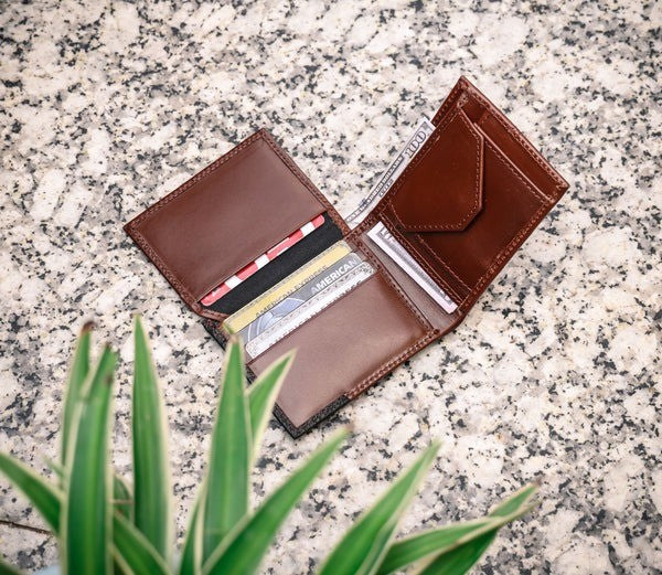GM Leather two-tone bifold wallet in smooth chestnut and textured black leather, handcrafted quality available at LynnMall, Auckland.