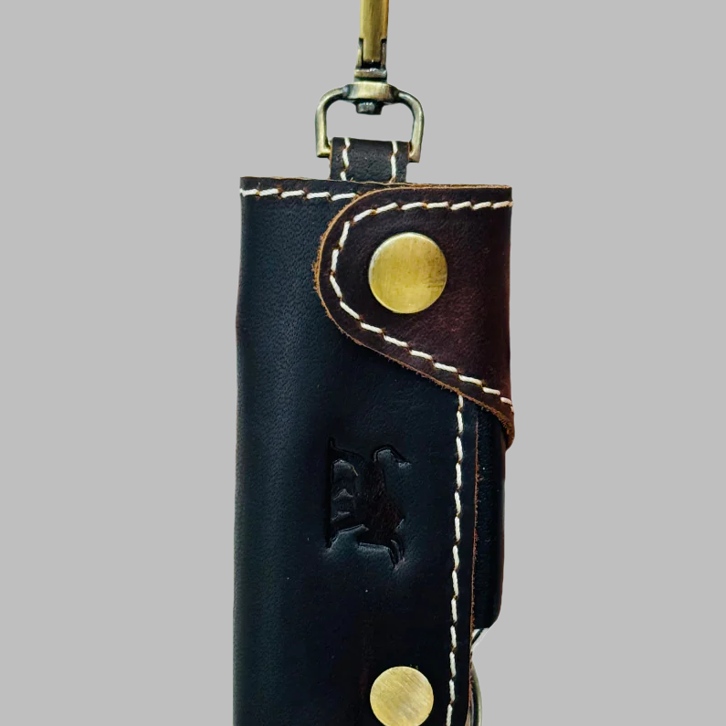 Handcrafted two-tone black and brown leather key holder pouch with brass clip and white stitching by GM Leather Auckland