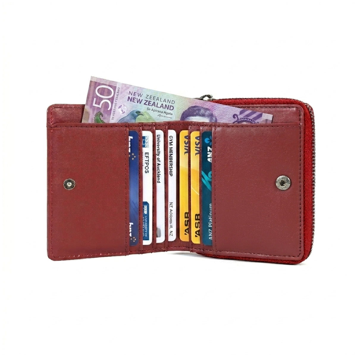 Red wallet with cards and a New Zealand banknote on a white background