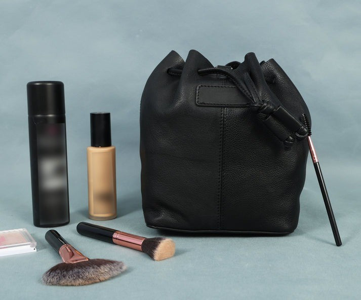 GM Leather Auckland small black full-grain leather bucket bag with drawstring and tassel detail, stylish women's crossbody available for purchase at Lynnmall New Lynn NZ