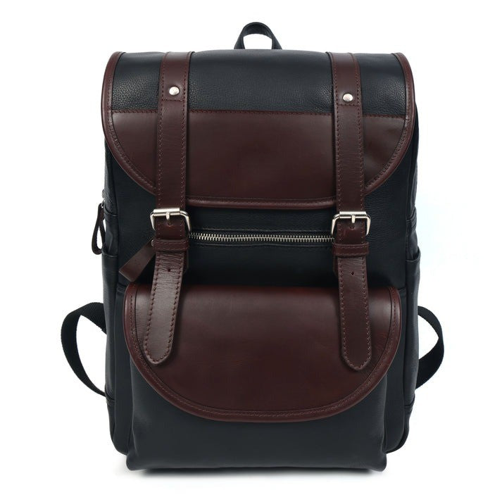 GM Leather Auckland two-tone black and brown leather rucksack, featuring buckle straps and a padded laptop sleeve, available for purchase at Lynnmall New Lynn NZ