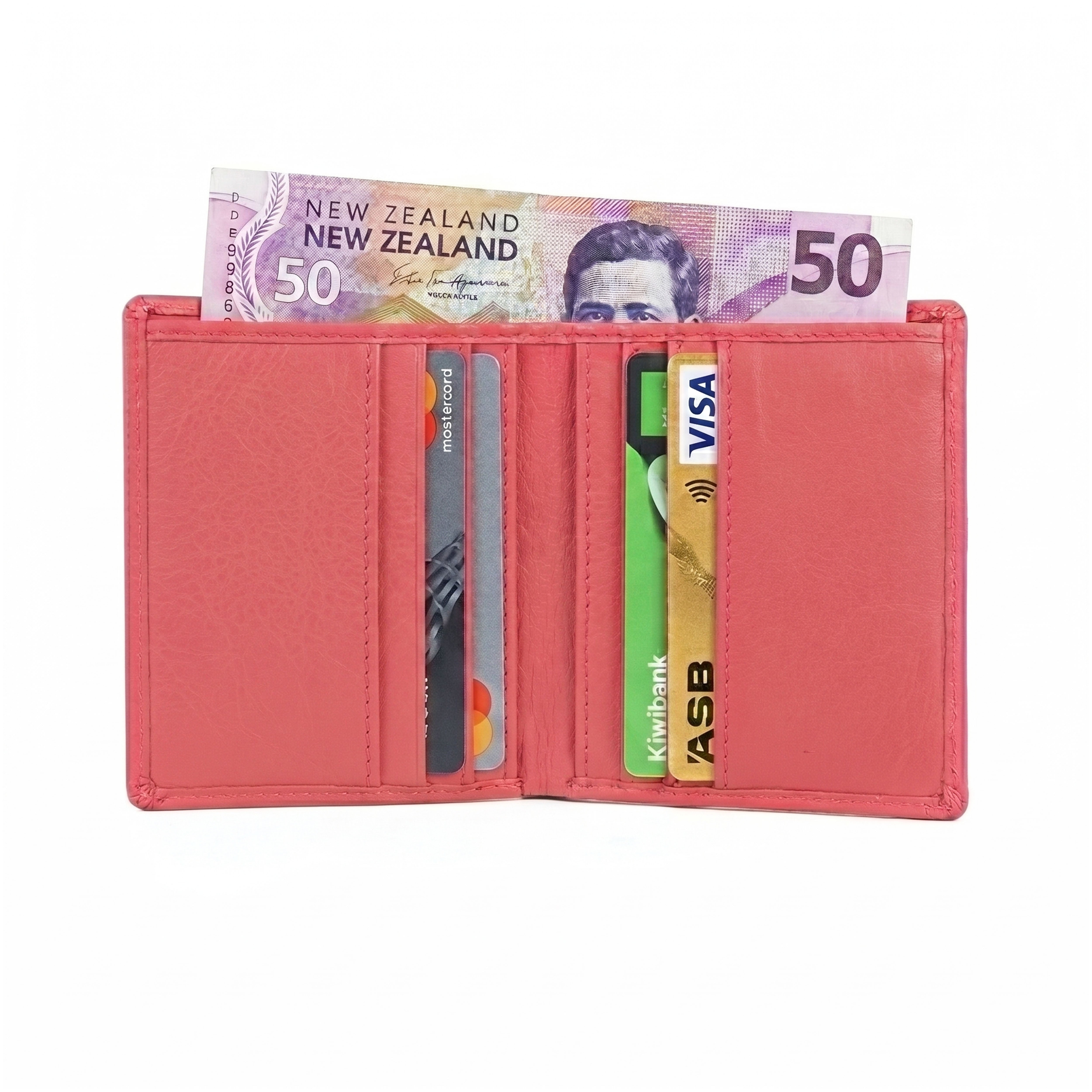 GM Leather handcrafted vertical bifold interior showing the salmon pink multi-slot vertical card holder arrangement filled with bank cards and the top currency compartment holding a New Zealand fifty-dollar note
